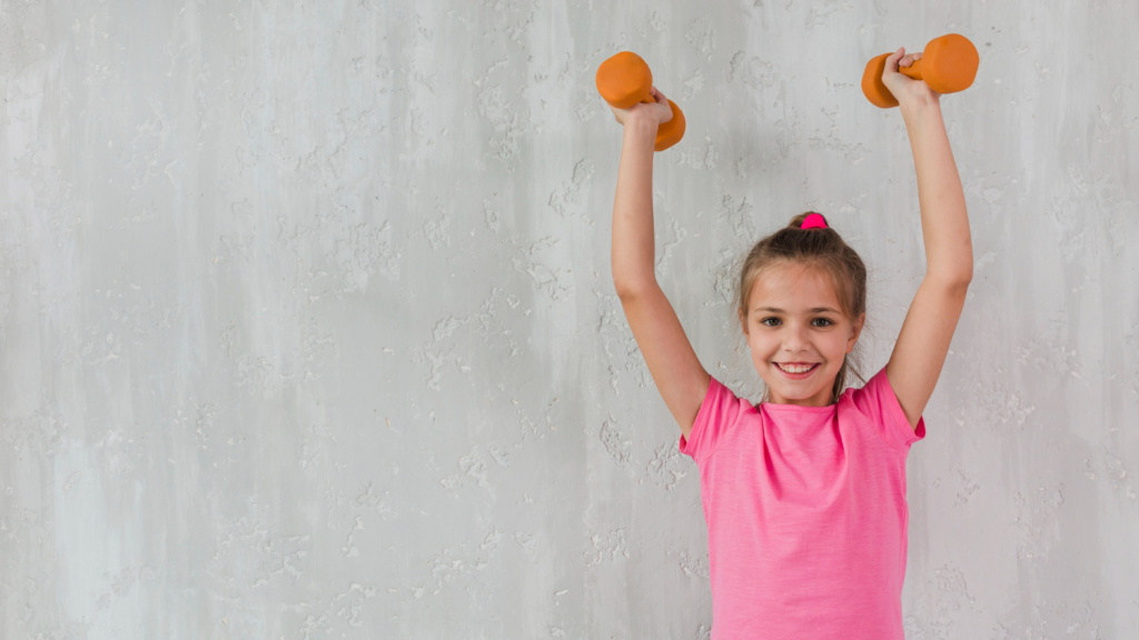 portrait-of-a-smiling-girl-raising-her-hands-holding-dumbbells-in-front-of-concrete-wall.jpg portrait-of-a-smiling-girl-raising-her-hands-holding-dumbbells-in-front-of-concrete-wall.jpg